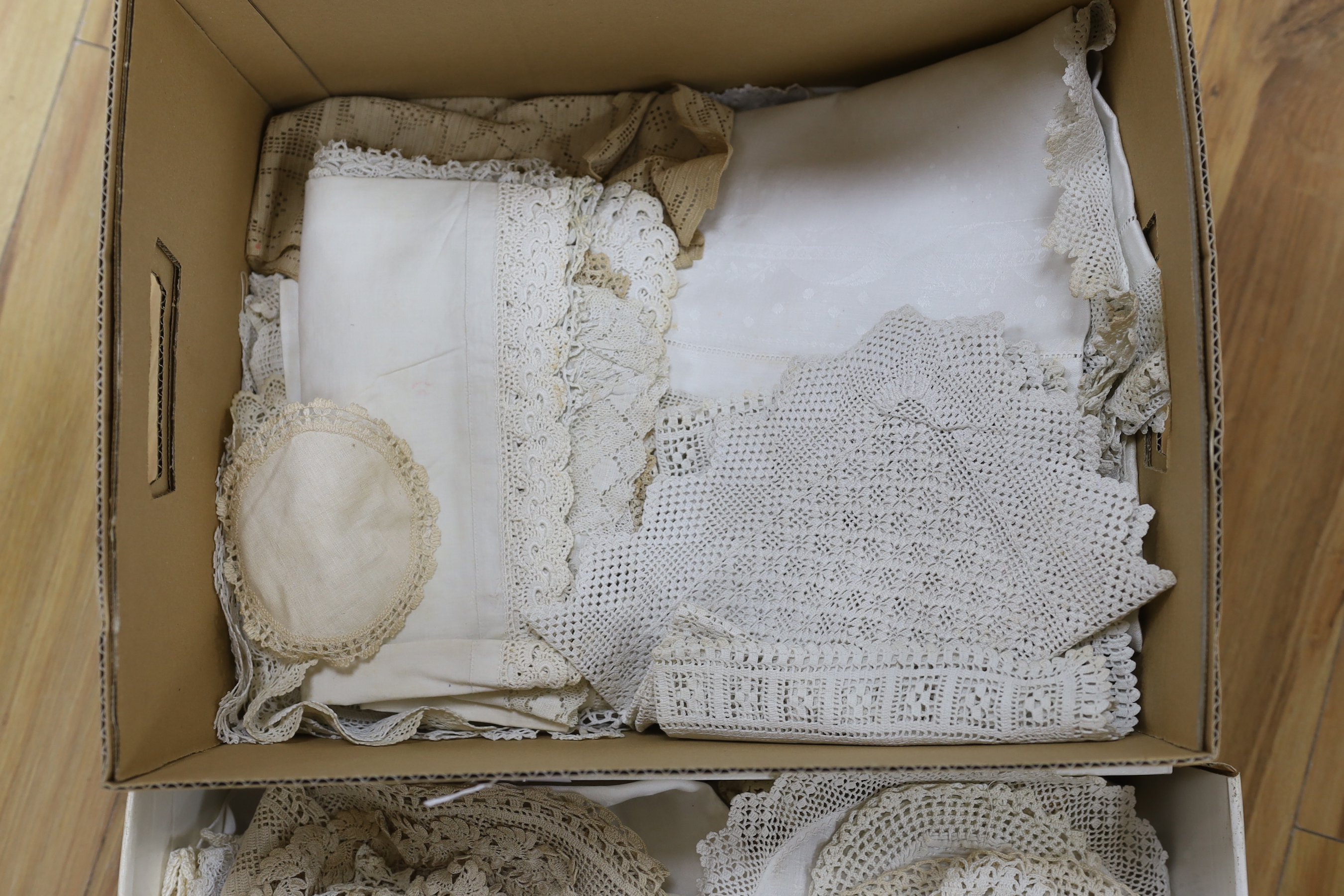 A large collection of ornate hand crochet edged table cloths, mats etc